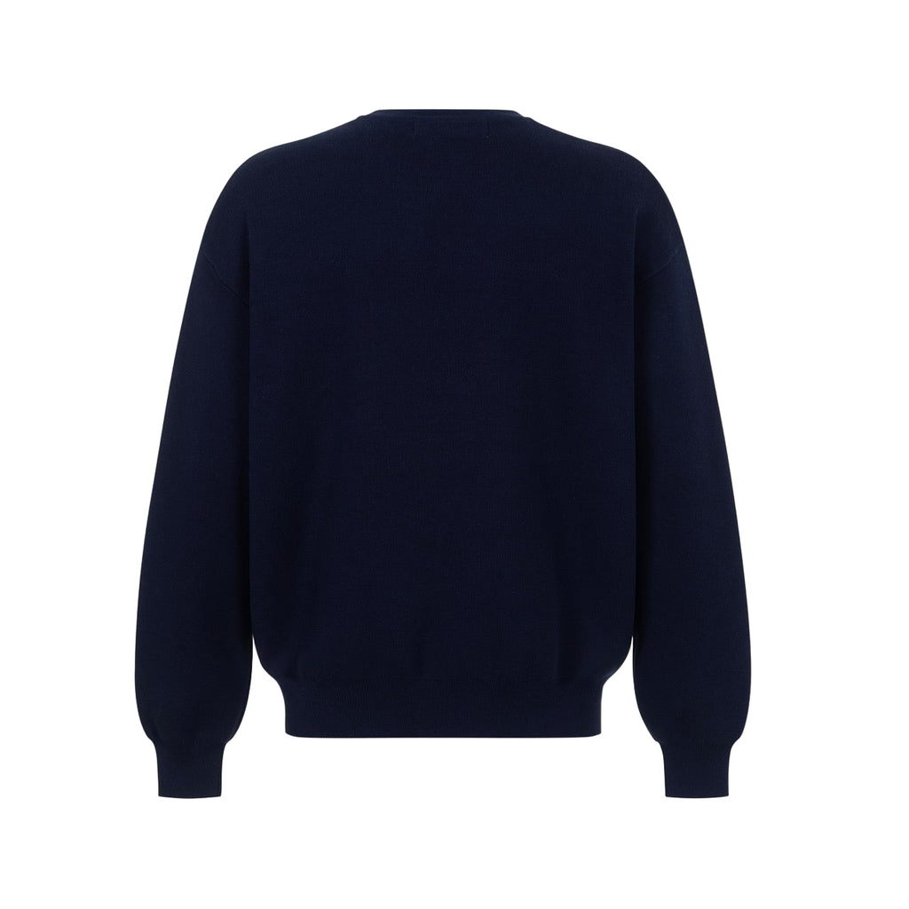 Navy blue sweater on a light gray background